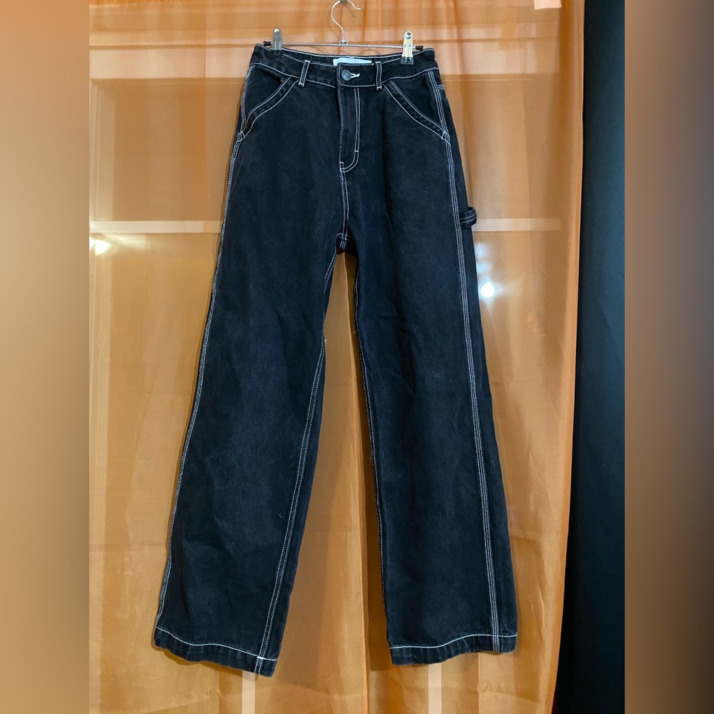 Black cargo style jeans with contrast white stitching